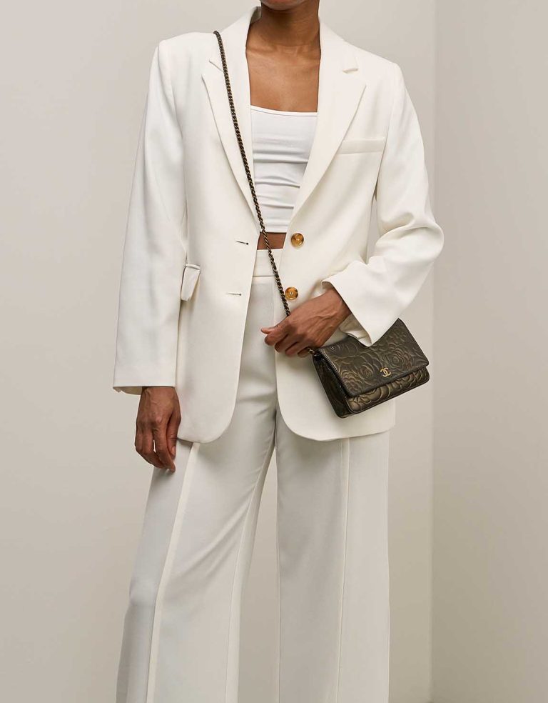 Chanel Timeless Camellia Wallet On Chain Lamb Black / Gold on Model | Sell your designer bag