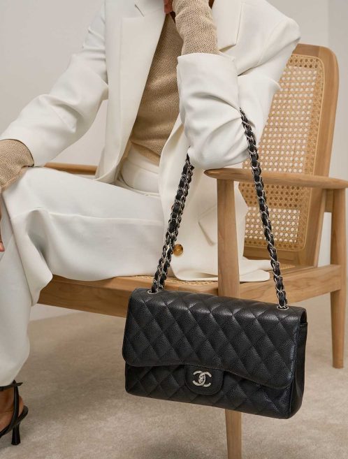 Chanel Timeless Jumbo Caviar Black on Model | Sell your designer bag