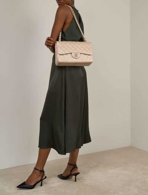 Chanel Timeless Jumbo Caviar Pearl Beige on Model | Sell your designer bag