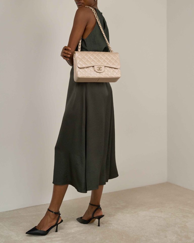 Chanel Timeless Jumbo Caviar Pearl Beige on Model | Sell your designer bag