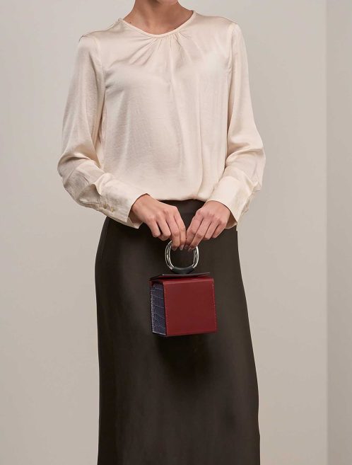 Hermès Petite h Minaudière Cube Helipse Porosus Crocodile / Swift Sienne / Blue Jean / Bleu Marine / Black on Model | Sell your designer bag