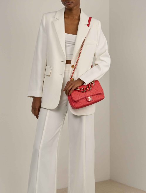 Chanel Timeless Medium Lamb Coral Red on Model | Sell your designer bag
