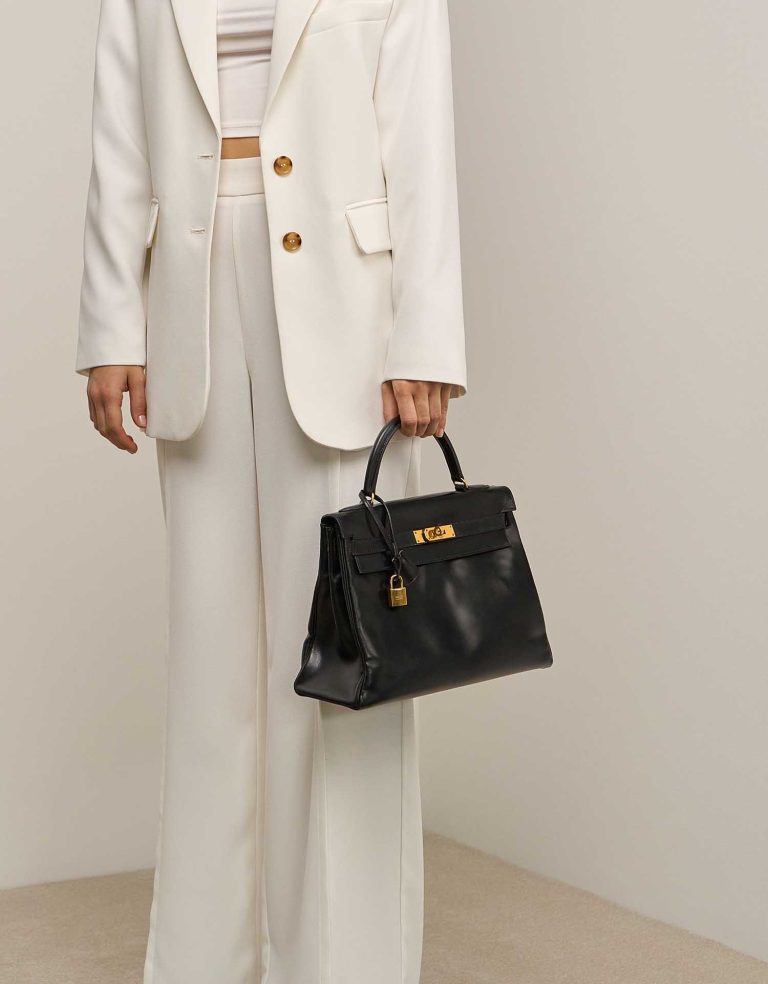Hermès Kelly 32 Box Black on Model | Sell your designer bag
