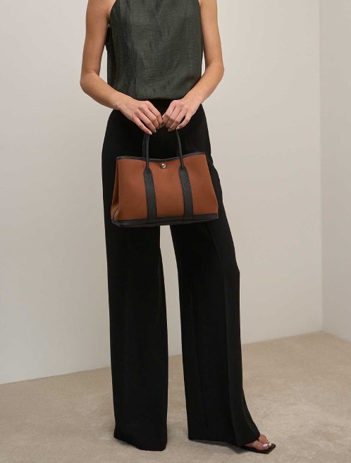 Hermès Garden Party 30 Toile / Veau Négonda Fauve / Black on Model | Sell your designer bag