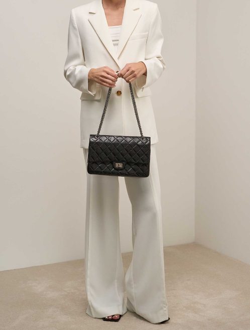 Chanel 2.55 Reissue 226 Aged Calf Black on Model | Sell your designer bag