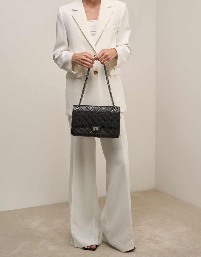 Chanel 2.55 Reissue 226 Aged Calf Black on Model | Sell your designer bag
