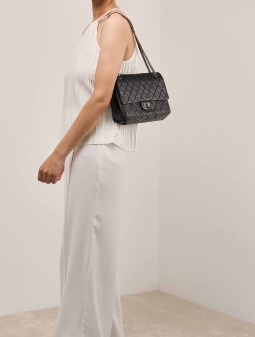 Chanel 2.55 Reissue 226 Aged Calf Black on Model | Sell your designer bag