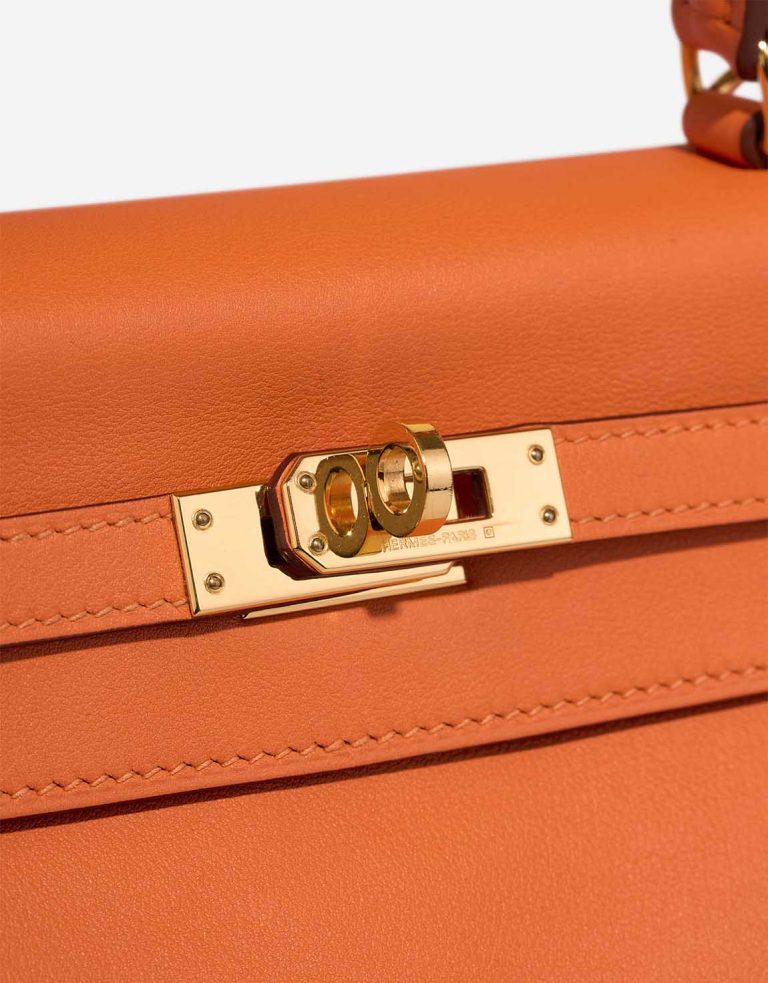 Hermès Kelly 25 Swift Orange H Closing System | Sell your designer bag