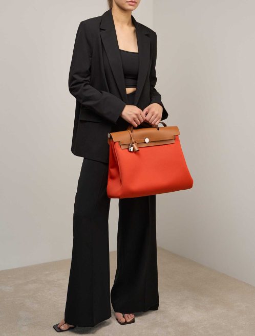 Hermès Herbag 39 Toile / Vache Hunter Orange Mécano / Fauve on Model | Sell your designer bag