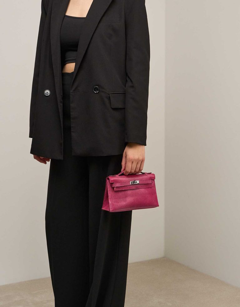 Hermès Kelly Pochette Niloticus Lizard Fuchsia on Model | Sell your designer bag