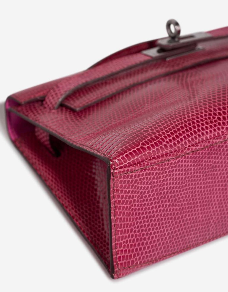 Hermès Kelly Pochette Niloticus Lizard Fuchsia Signs of wear | Sell your designer bag