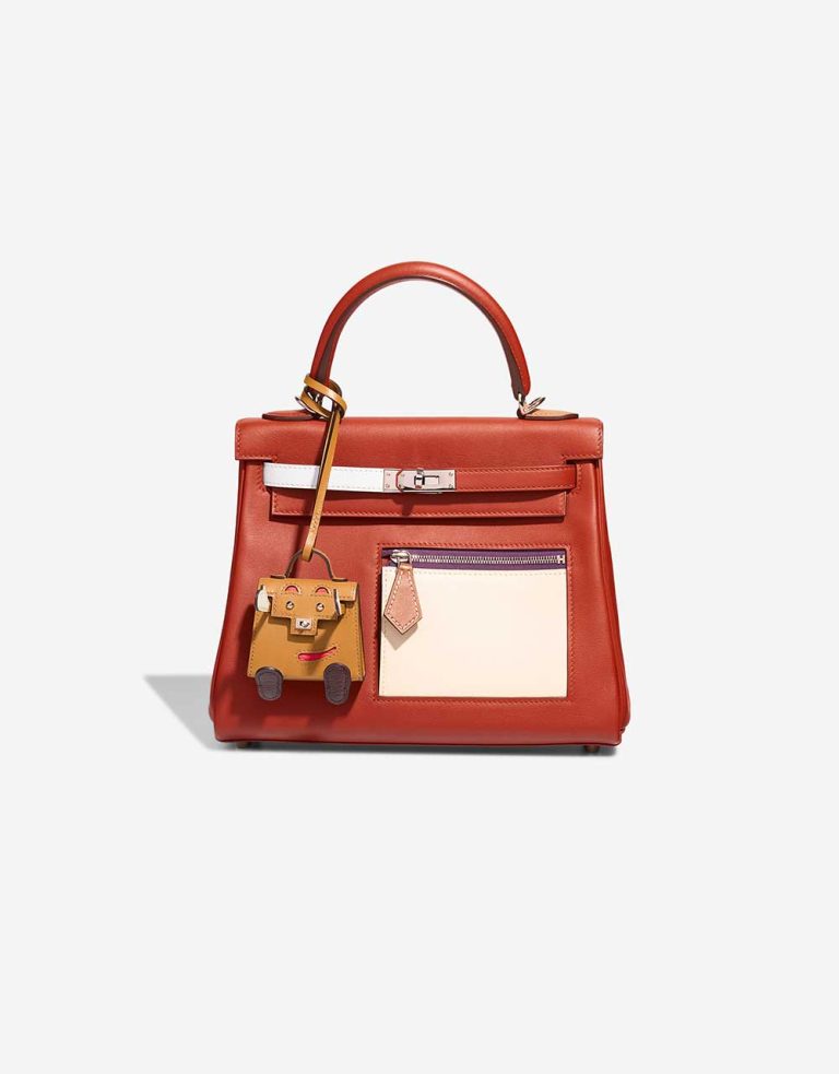 Hermès Kelly Doll Bag Charm Tadelakt / Chèvre Mysore Poussière / Rose Texas / Vert Fizz / Rouge Sellier Closing System | Sell your designer bag