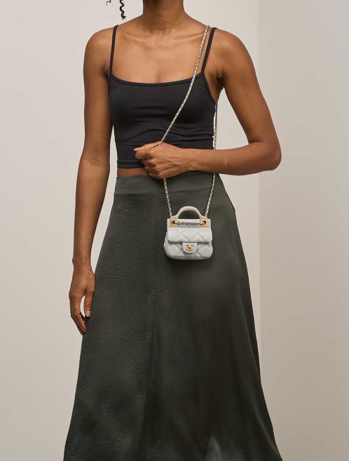 Chanel Timeless Handle Micro Lamb Grey on Model | Sell your designer bag