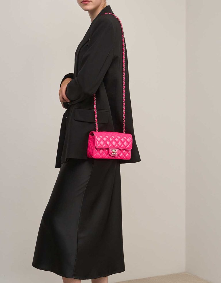 Chanel Timeless Mini Rectangular Patent Neon Pink on Model | Sell your designer bag