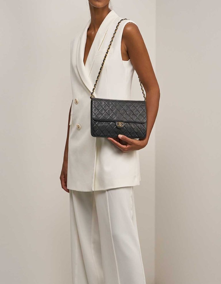 Chanel Timeless Medium Lamb Black on Model | Sell your designer bag