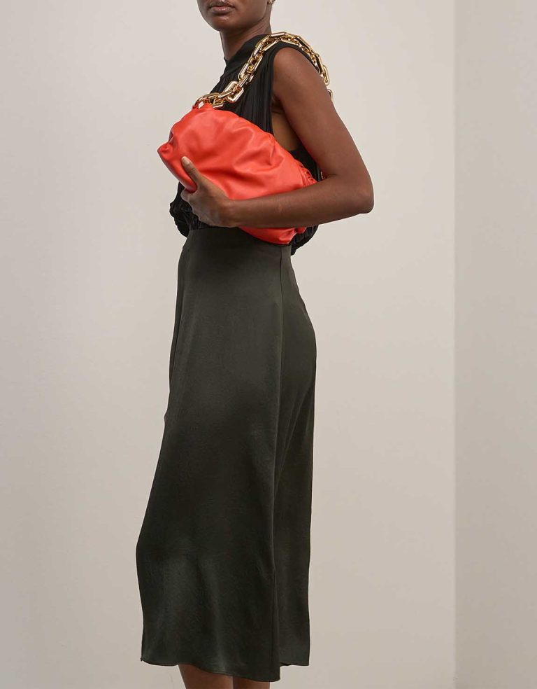 Bottega Veneta Chain Pouch Medium Calf Orange on Model | Sell your designer bag