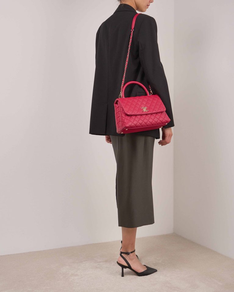 Chanel Timeless Handle Medium Caviar Red on Model | Sell your designer bag