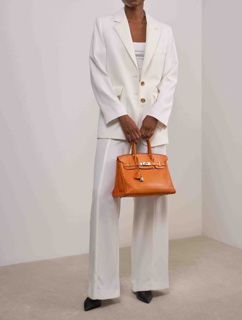 Hermès Birkin 30 Clémence Orange on Model | Sell your designer bag