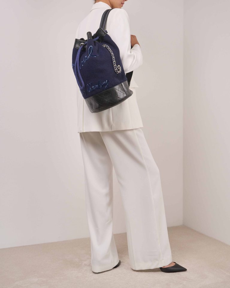 Chanel Backpack Wool / Lamb Blue / Black on Model | Sell your designer bag