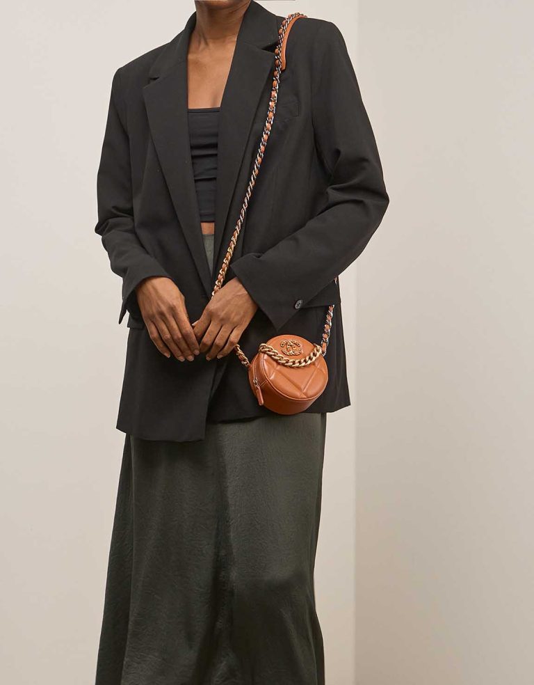 Chanel 19 Round Clutch Lamb Brown on Model | Sell your designer bag