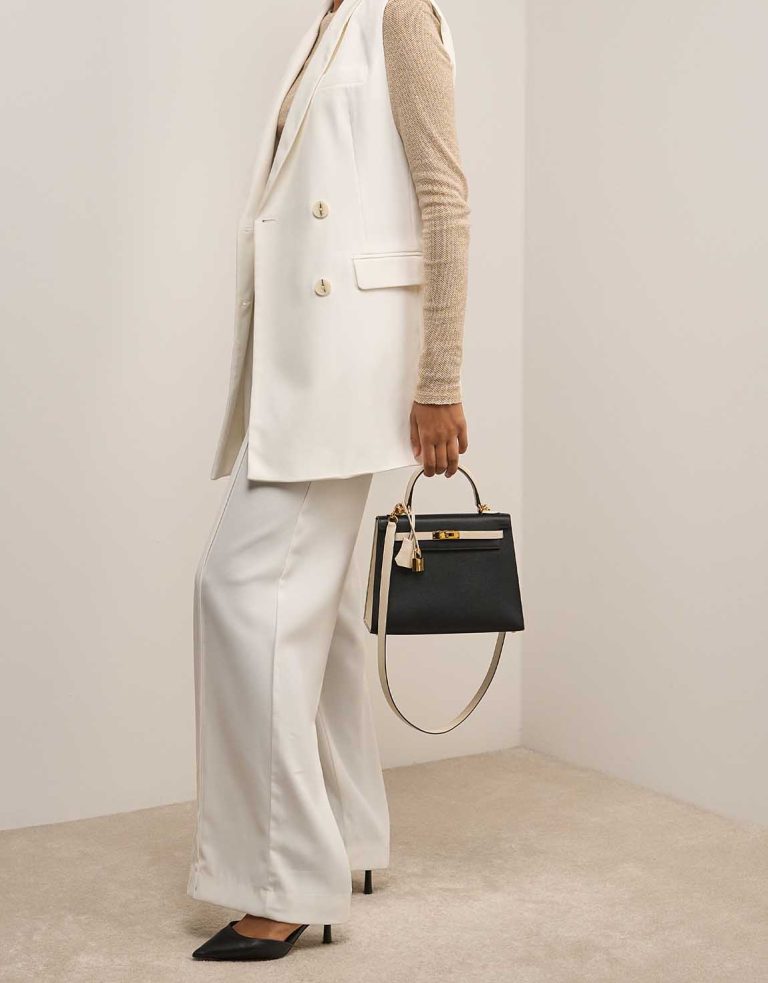 Hermès Kelly Sellier 25 Epsom Black / Craie on Model | Sell your designer bag