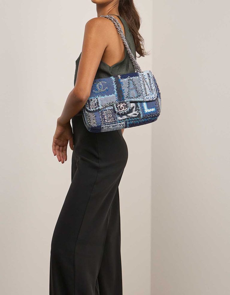 Chanel Timeless Jumbo Fabric / Denim Blue on Model | Sell your designer bag