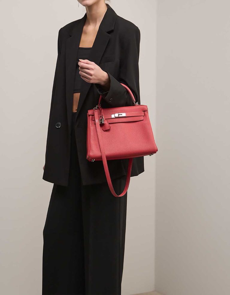 Hermès Kelly 28 Togo Rouge Pivoine on Model | Sell your designer bag