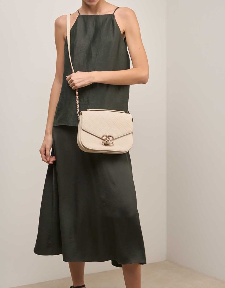 Chanel Flap Bag Caviar Cream on Model | Sell your designer bag