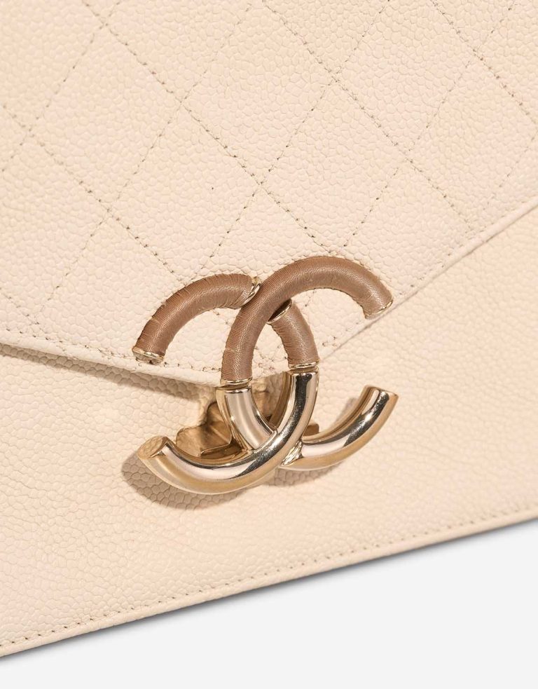 Chanel Flap Bag Caviar Cream Closing System | Sell your designer bag