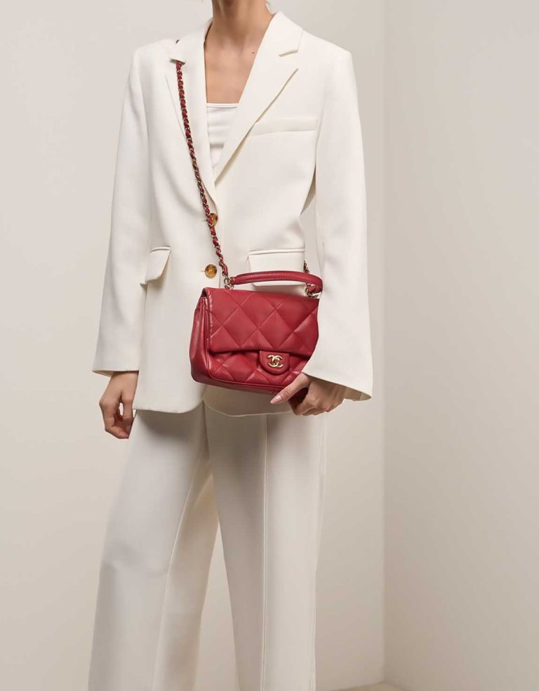 Chanel Timeless Flap Bag Small Lamb Red on Model | Sell your designer bag