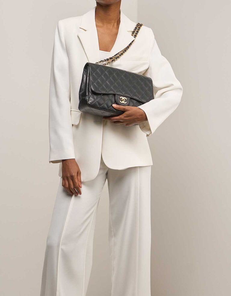 Chanel Timeless Jumbo Caviar Black on Model | Sell your designer bag