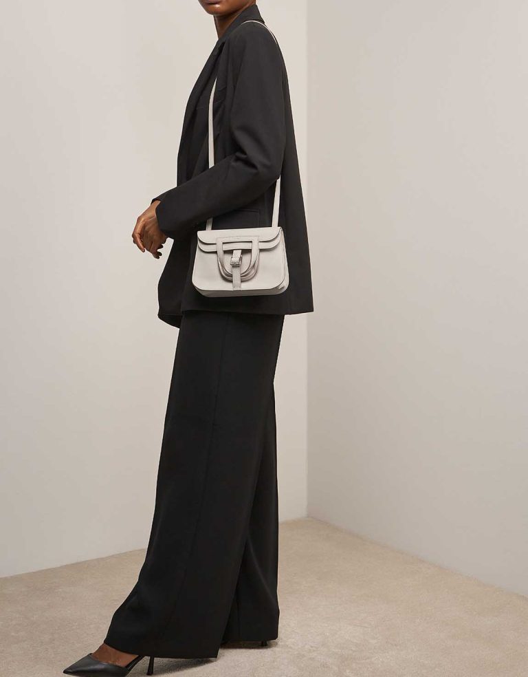 Hermès Halzan Mini Swift Béton on Model | Sell your designer bag