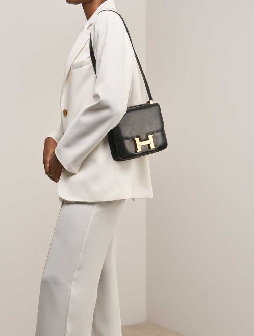 Hermès Constance 23 Box Black on Model | Sell your designer bag
