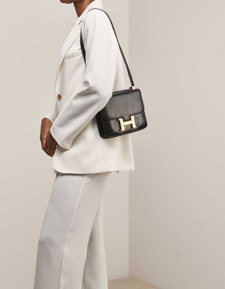Hermès Constance 23 Box Black on Model | Sell your designer bag