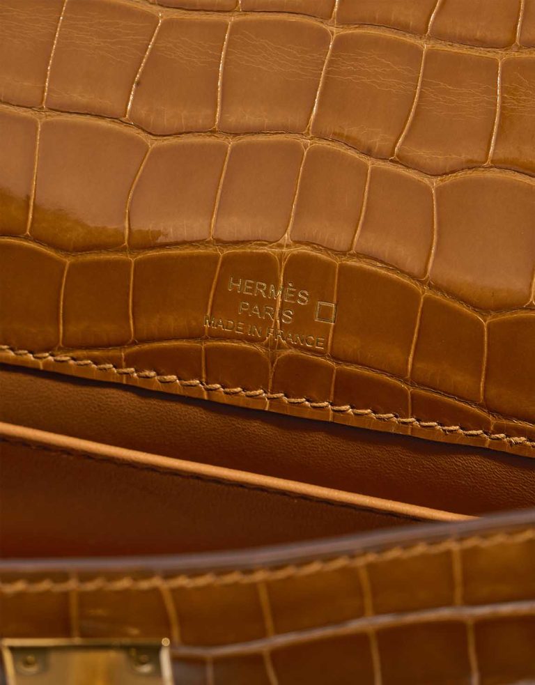 Hermès Kelly Pochette Alligator Mississippi Tabac Camel Logo | Sell your designer bag