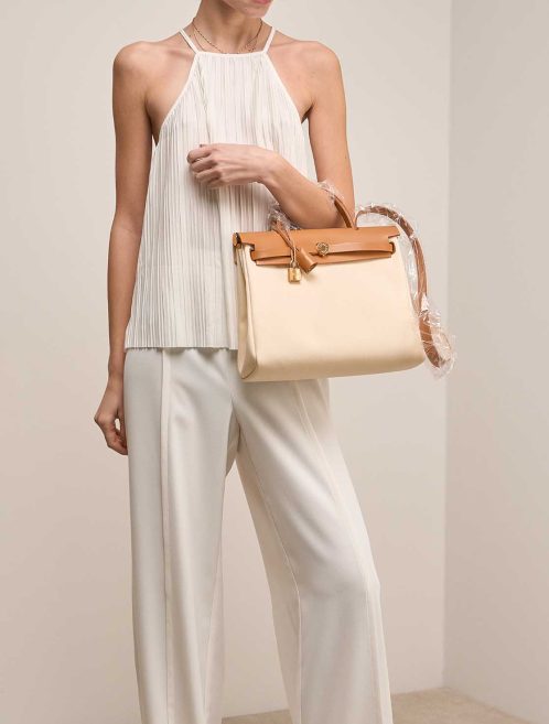 Hermès Herbag 31 Toile / Vache Hunter Vanille / Sable Naturel on Model | Sell your designer bag