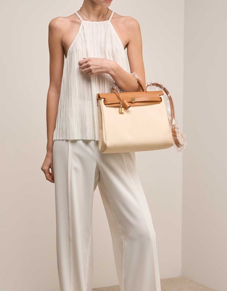 Hermès Herbag 31 Toile / Vache Hunter Vanille / Sable Naturel on Model | Sell your designer bag