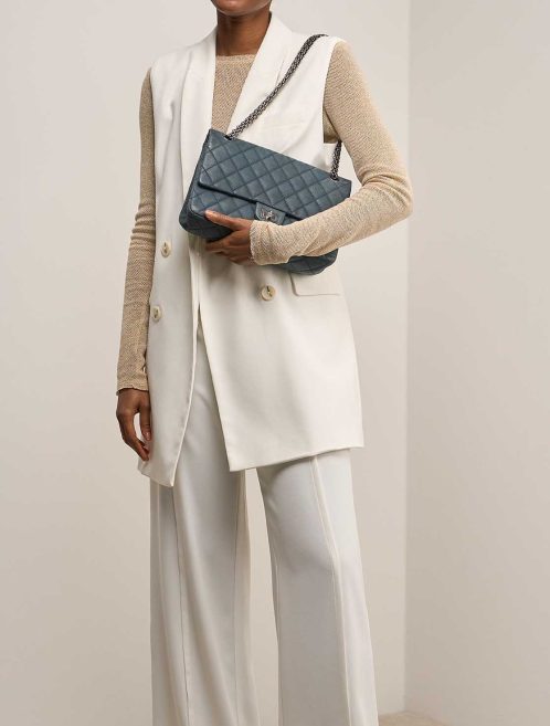 Chanel 2.55 Reissue 226 Caviar Petrol Blue on Model | Sell your designer bag