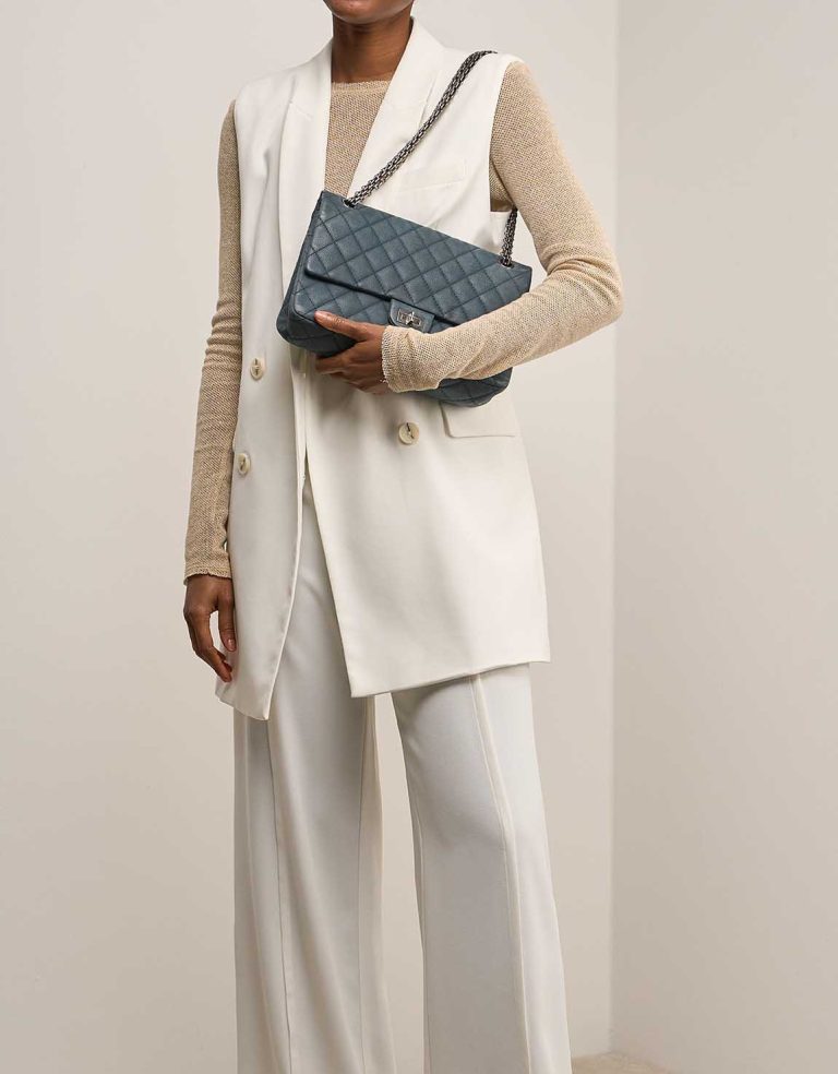 Chanel 2.55 Reissue 226 Caviar Petrol Blue on Model | Sell your designer bag