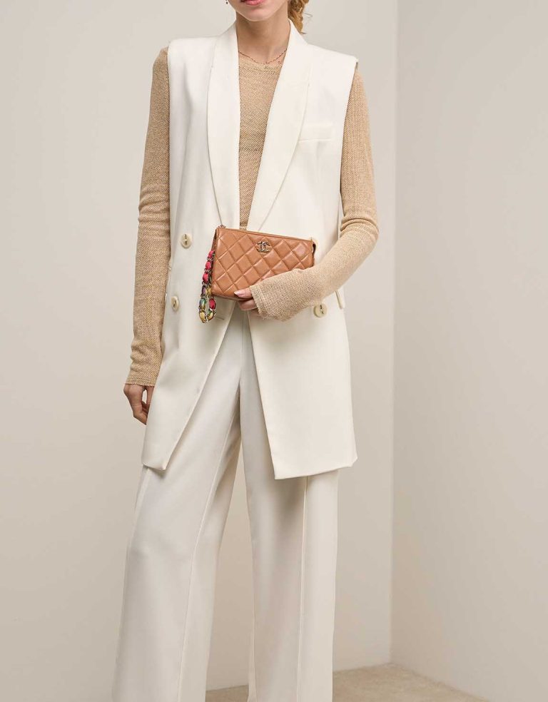 Chanel Pouch Small Lamb Cognac on Model | Sell your designer bag