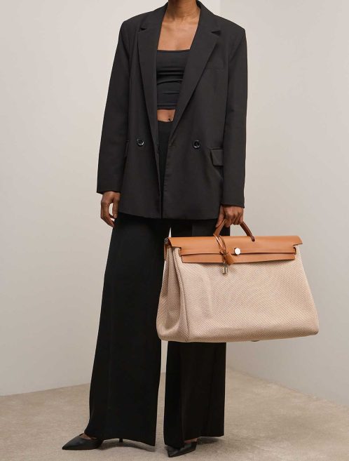 Hermès Herbag 50 Vache Hunter / Toile Quadrille Naturel / Écru / Gold on Model | Sell your designer bag