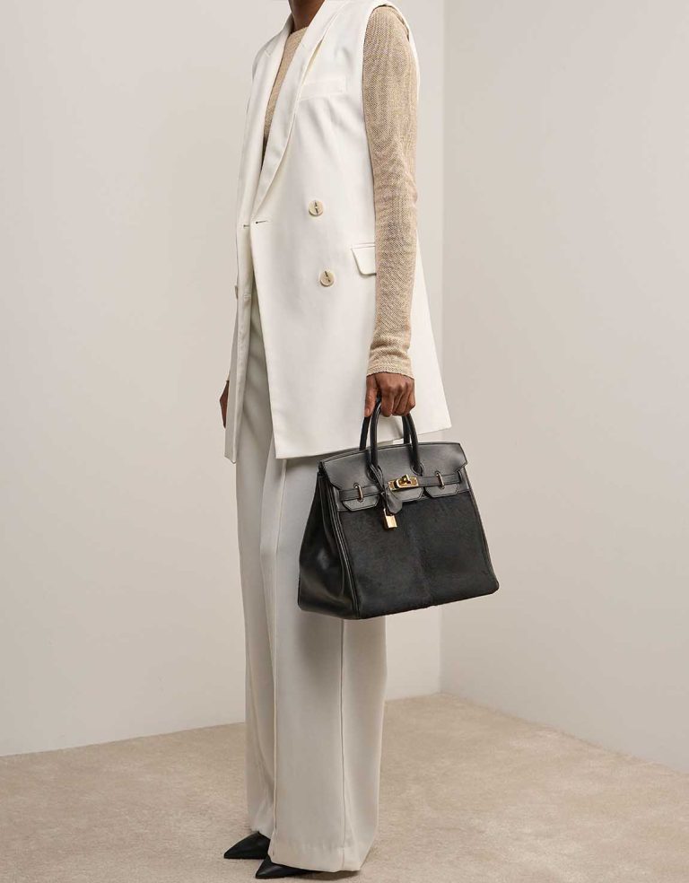 Hermès Haut à Courroies 32 Evercalf / Pony Hair Black on Model | Sell your designer bag