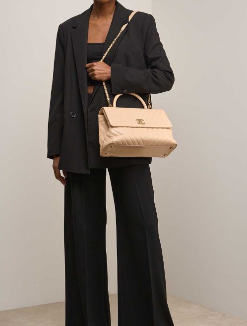 Chanel Timeless Handle Large Calf Beige on Model | Sell your designer bag