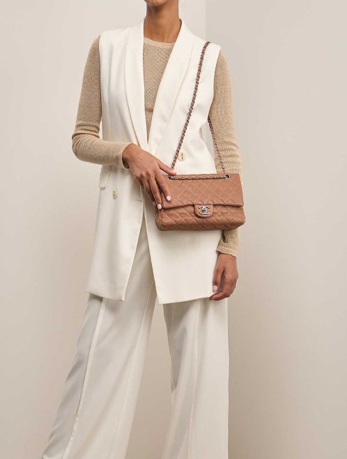 Chanel Timeless Medium Caviar Brown on Model | Sell your designer bag
