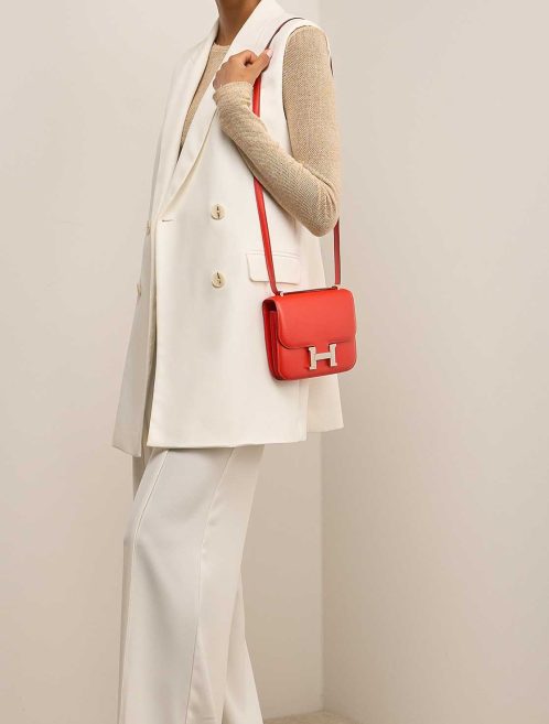 Hermès Constance 18 Tadelakt Rouge Tomate on Model | Sell your designer bag