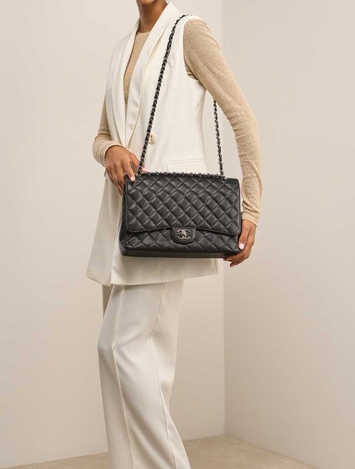 Chanel Timeless Maxi Caviar Black on Model | Sell your designer bag