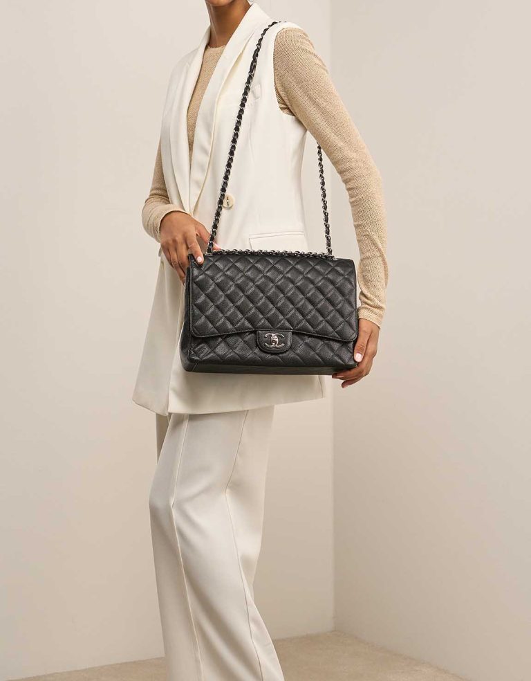 Chanel Timeless Maxi Caviar Black on Model | Sell your designer bag
