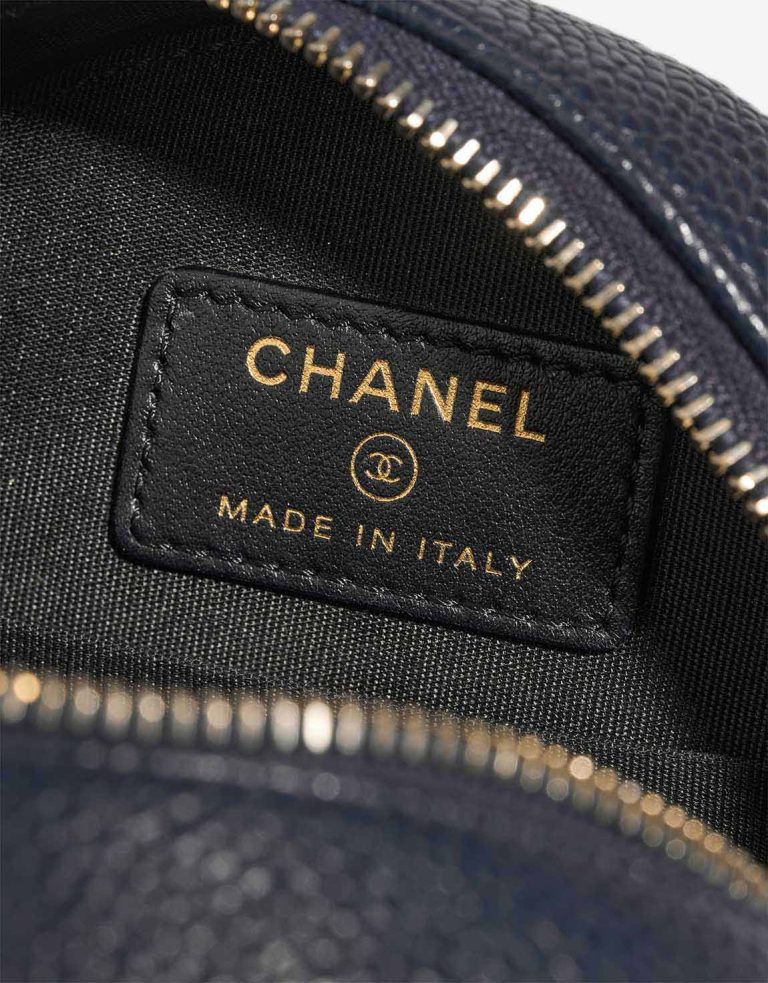 Chanel Filigree Round Clutch Caviar Dark Blue Logo | Sell your designer bag