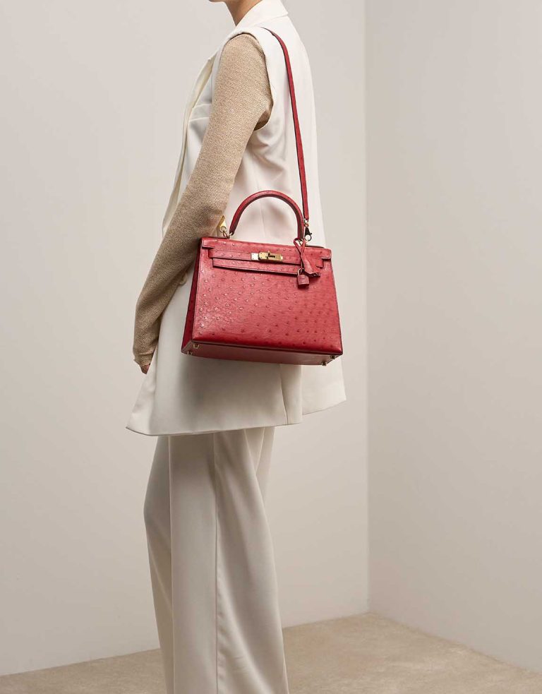 Hermès Kelly 28 Ostrich Rouge Vif on Model | Sell your designer bag