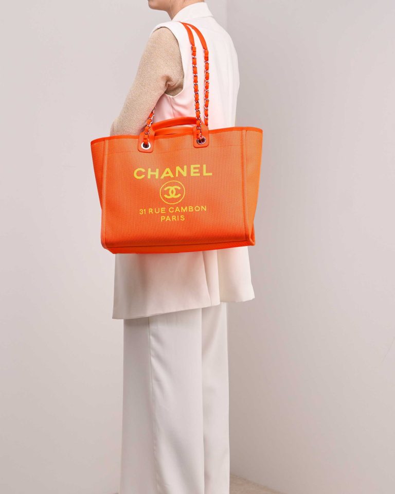 Chanel Deauville Large Canvas Neon Orange / Neon Yellow on Model | Sell your designer bag